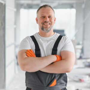 Man Builder. Architect is standing in building. Portrait of thinking builder.